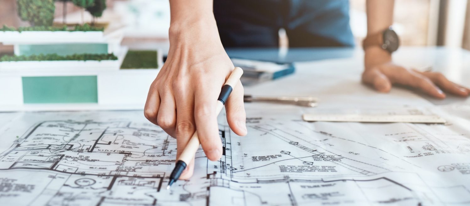 Architect,,Hand,And,Blueprint,On,Paper,In,Office,With,Property